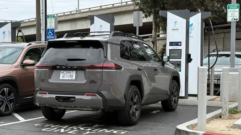 2026 Toyota RAV4 Woodland PHEV charging at an Electrify America station