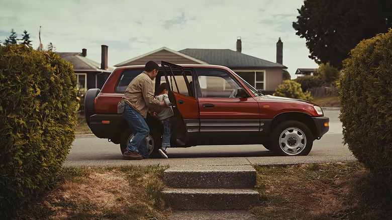 grandfather and grandson getting into retro rav4 toyota ad screenshot