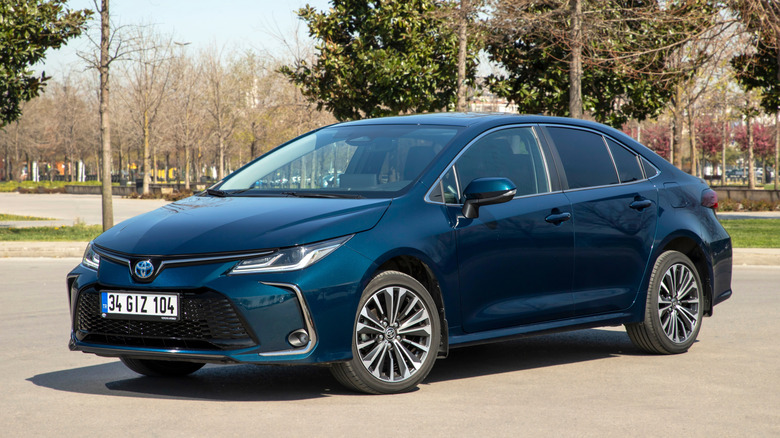A blue 2024 Toyota Corolla Hybrid parked