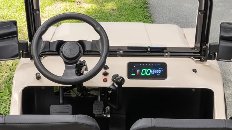 The steering wheel and digital display in a Massimo Motor Mini Truck.
