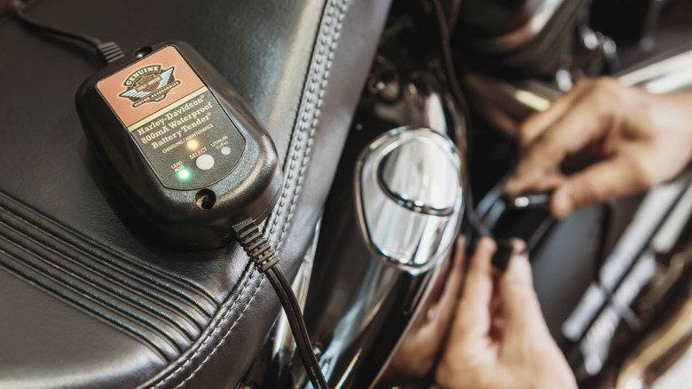 A Harley-Davidson battery tender in use.