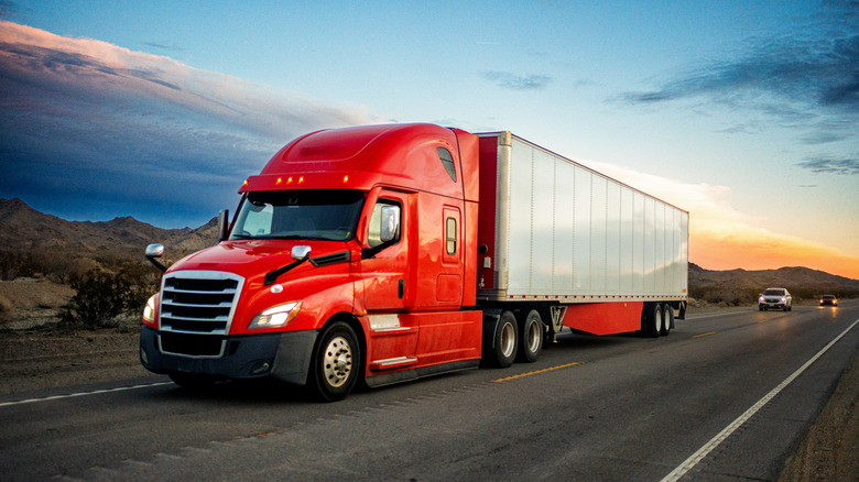 Red semi truck on the highway