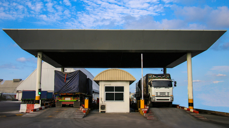 Two trucks at weigh station