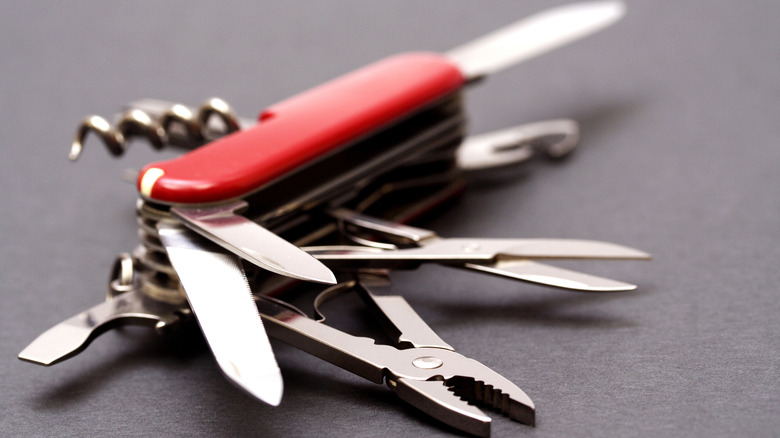 open swiss army knife lying on table