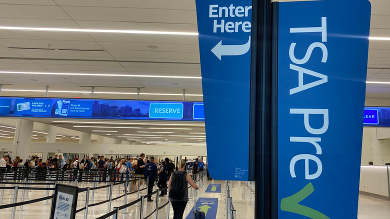 A traveler walks through a TSA Pre Check security line at Terminal C at Orlando International Airport