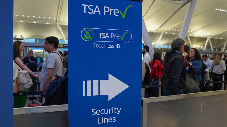 Travelers wait in a TSA Pre security line in Terminal 4 at John F Kennedy Airport