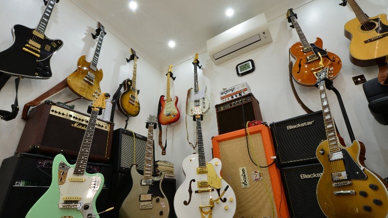 guitars and amplifiers in a room