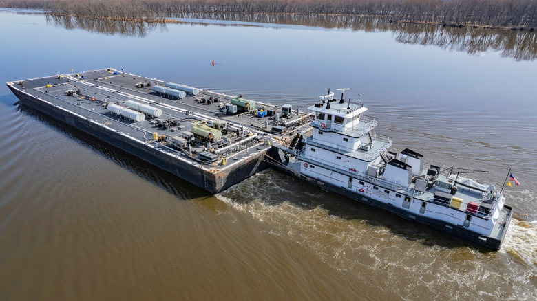 Towboat in river pushing a barge