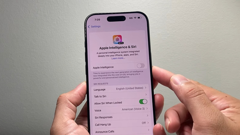iPhone in hand showing the Apple Intelligence menu