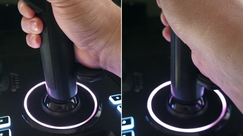 A hand holding the VelocityOne Flightstick II, showing its Z-axis movement