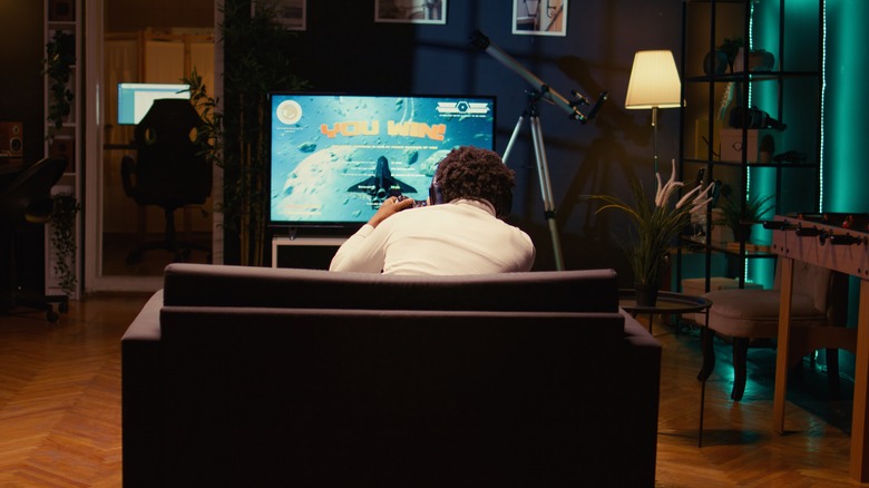 Guy sitting in front of TV