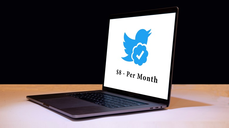 Twitter blue $8 on a laptop