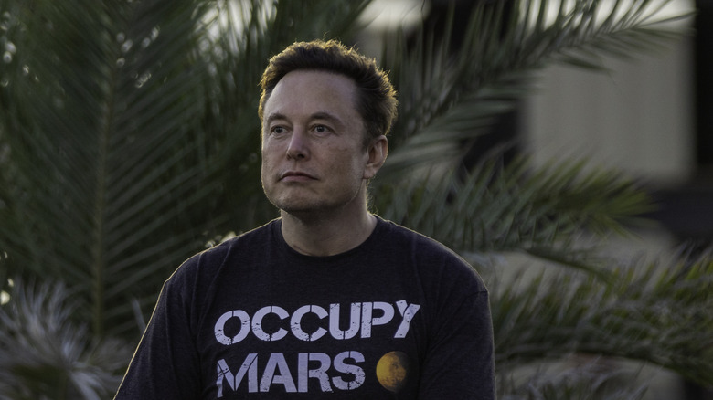 Elon Musk sitting at a T-Mobile event.