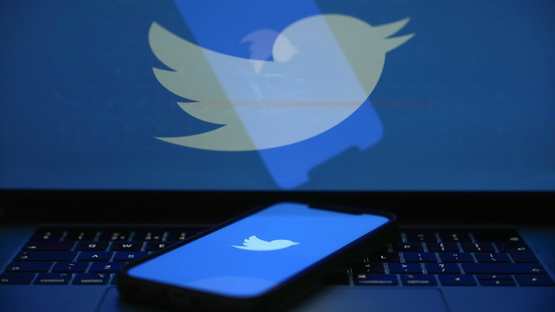 Twitter logo on phone and computer