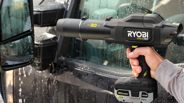 Person using Limited Edition Ryobi Blower to dry a wet car