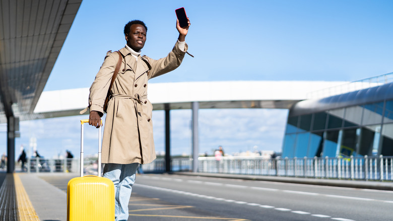 person waiting for ride at airport