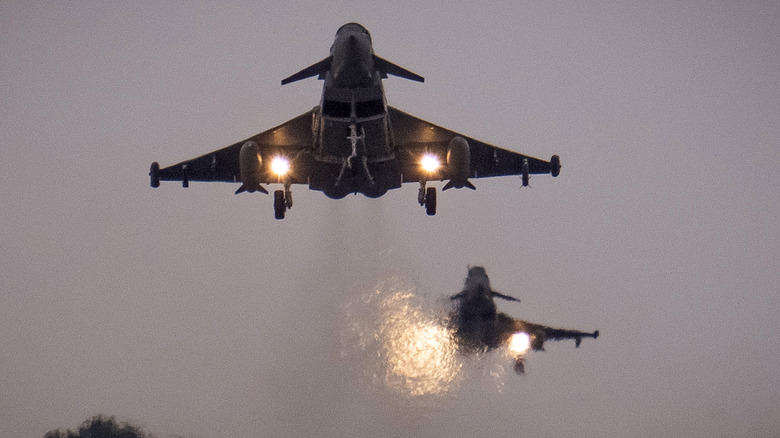 Two Typhoon jet fighters taking off in close formation