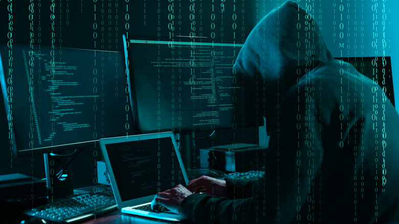 Hacker at computer station