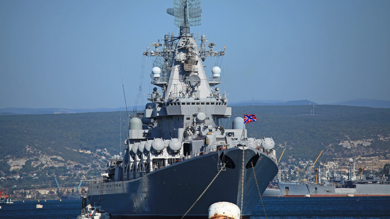 The flagship of Russia's Black Sea Fleet, the Moskva at anchor in a harbour.