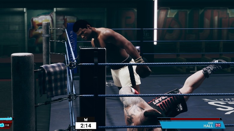 Ali leaning awkwardly over a downed Eddie Hall