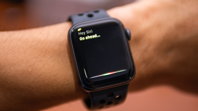 Man asking Siri question Apple Watch