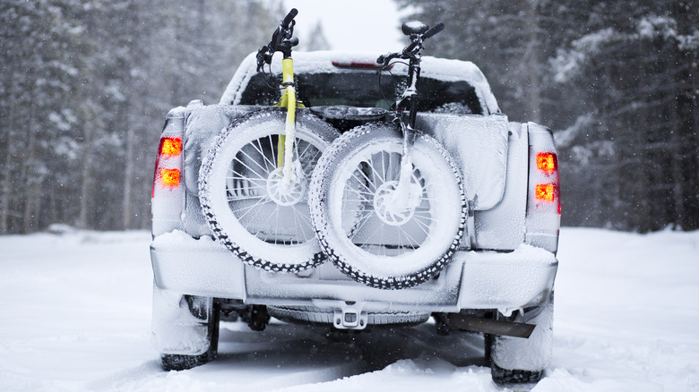 Truck carrying bikes through snow