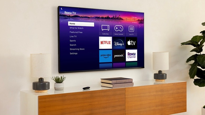Roku Pro Series TV in home screen on living room above TV stand