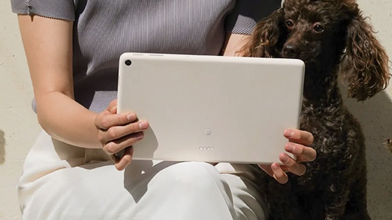 Woman holding Google Pixel Tablet