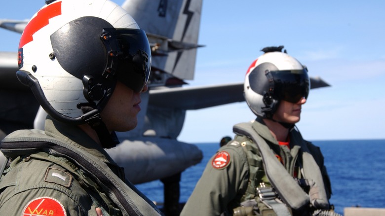 Two Navy Aviators aboard the USS Theodore Roosevelt on the flight deck