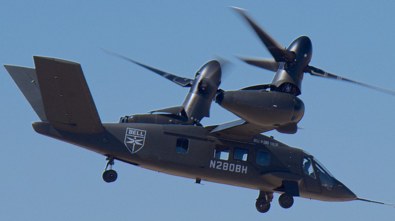 A Bell V-280 Valor taking off against a clear blue sky