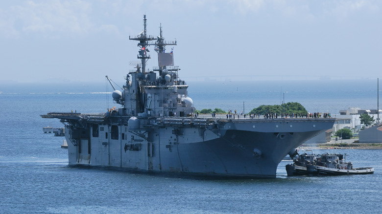 A Wasp class vessel of the US Navy anchored off the coast of Japan