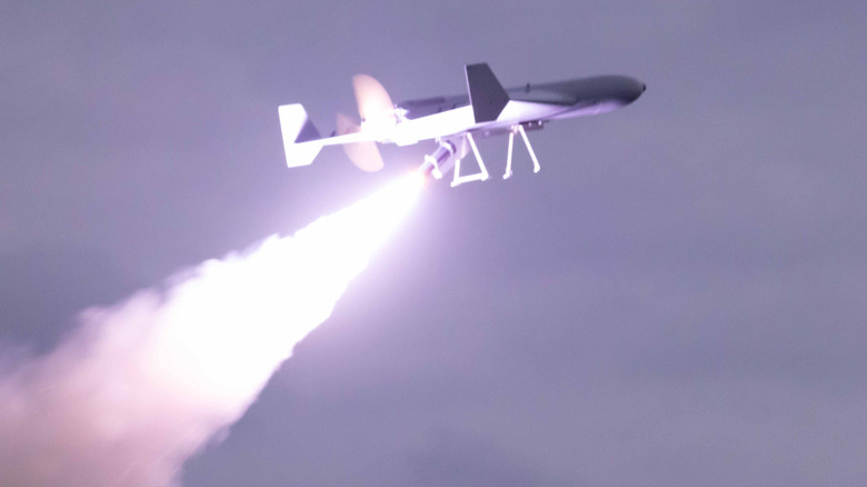 LUCAS drone launching from deck of USS Santa Barbara into cloudy sky