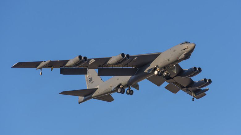 A B-52 in the air with it's landing gear down