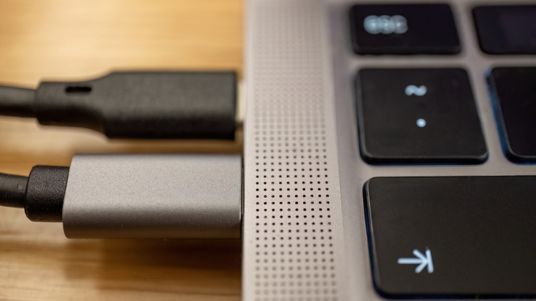 USB cables plugged into a laptop