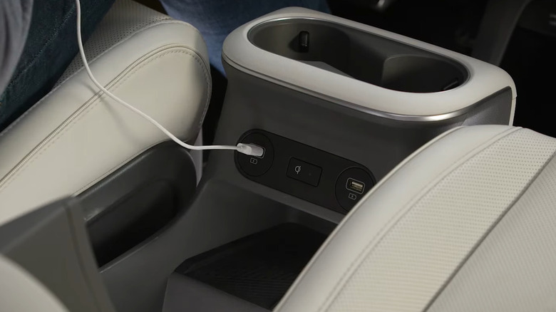 A white USB cable connected to car
