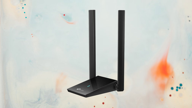 wireless network adapter on a paint splattered background