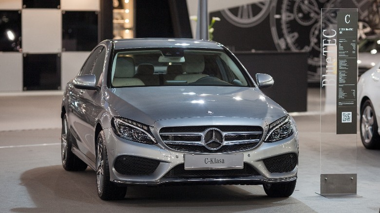 a grey Mercedez-Benz coupe in a showroom