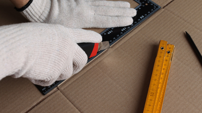 Person using box cutter