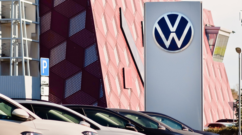 Volkswagen cars in front of Volkswagen showroom