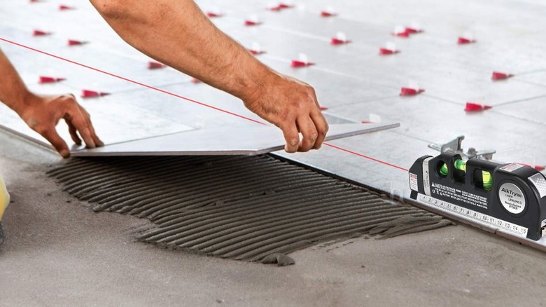 AikTryee Laser Level Line Tool used to align tiles