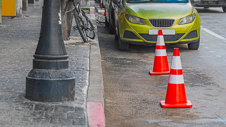 Traffic cones block parking space in street