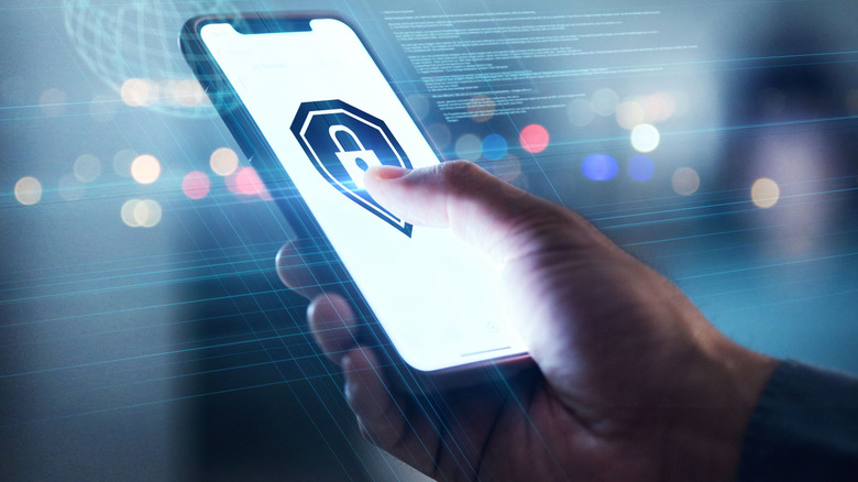 A cybersecurity symbol appears on a cellphone.