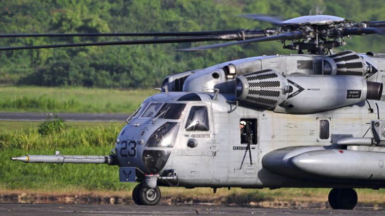 A Sikorsky CH-53 helicopter on an airport runway