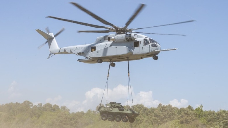 A Light Armored Vehicle being transported by a CH-53K King Stallion helicopter.