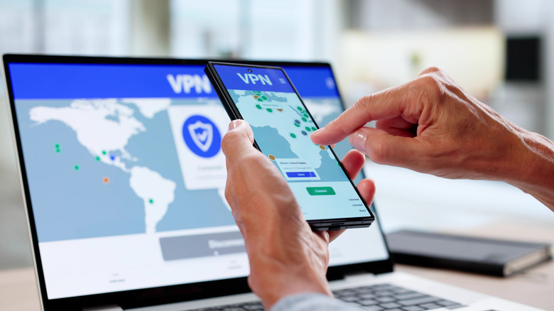 Person using VPN on phone and laptop