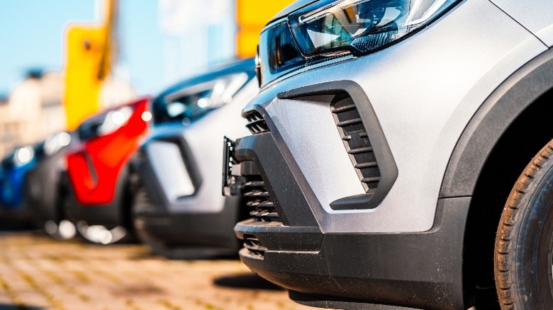 A row of cars of the same model in different colors