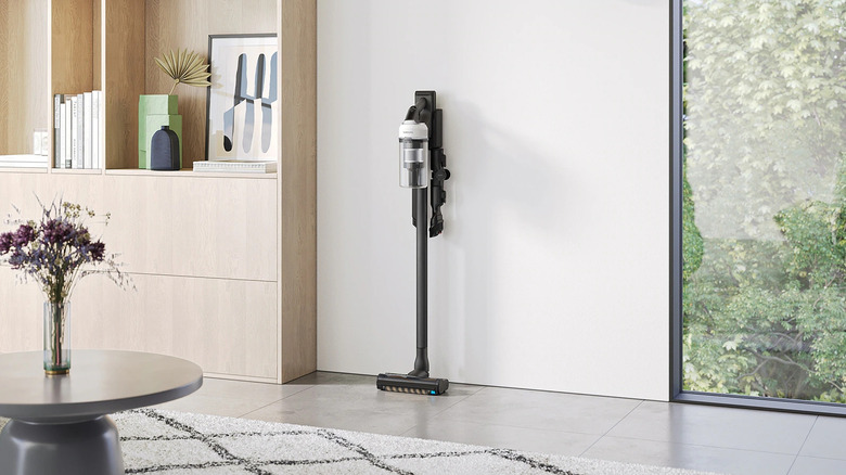 Mid-range Samsung Jet 85 vacuum stands upright in living room