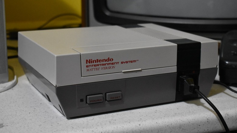The Mattel version of the Nintendo Entertainment System sitting in front of a CRT television