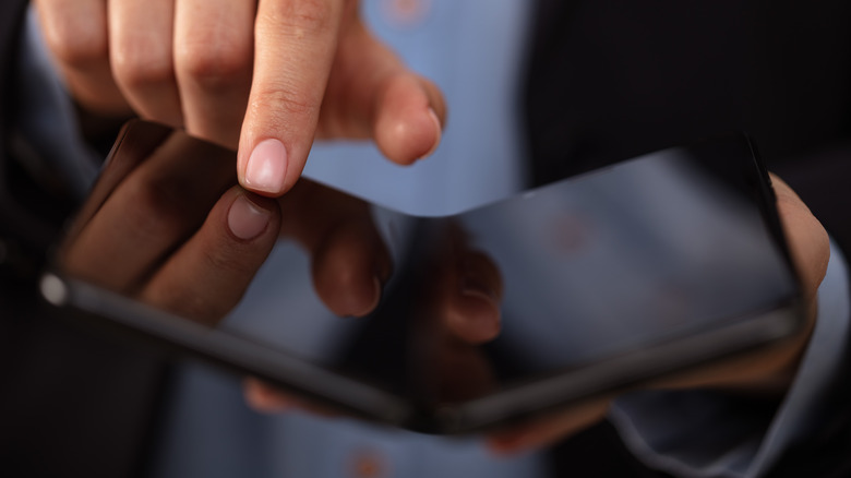 Folding smartphone in hands