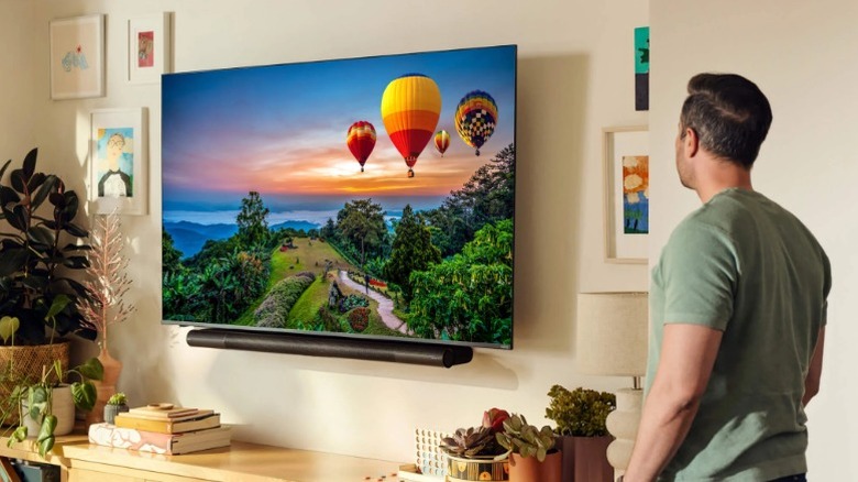 Person looking at TV on wall